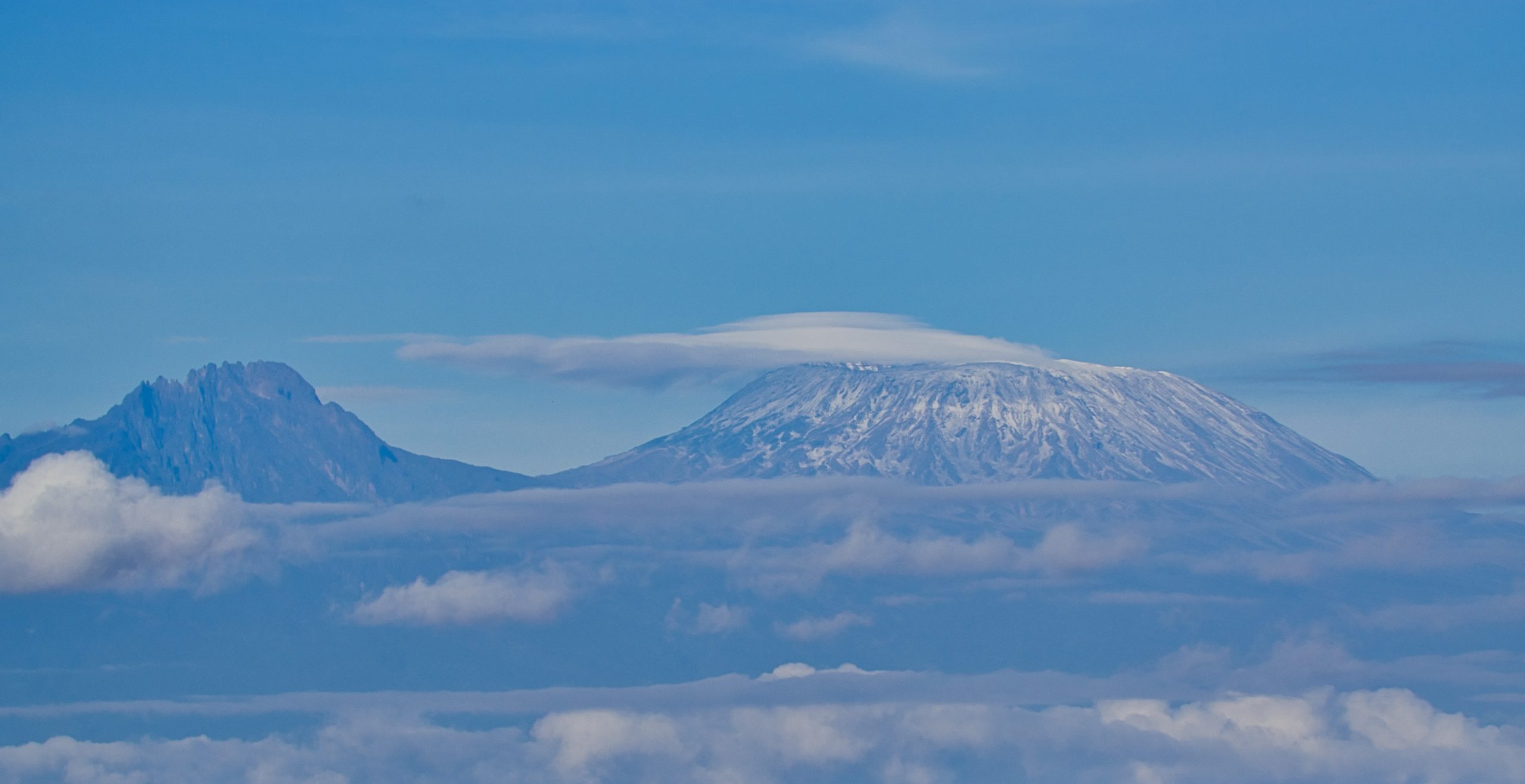 A prepared trekker looking up toward the Kilimanjaro summit