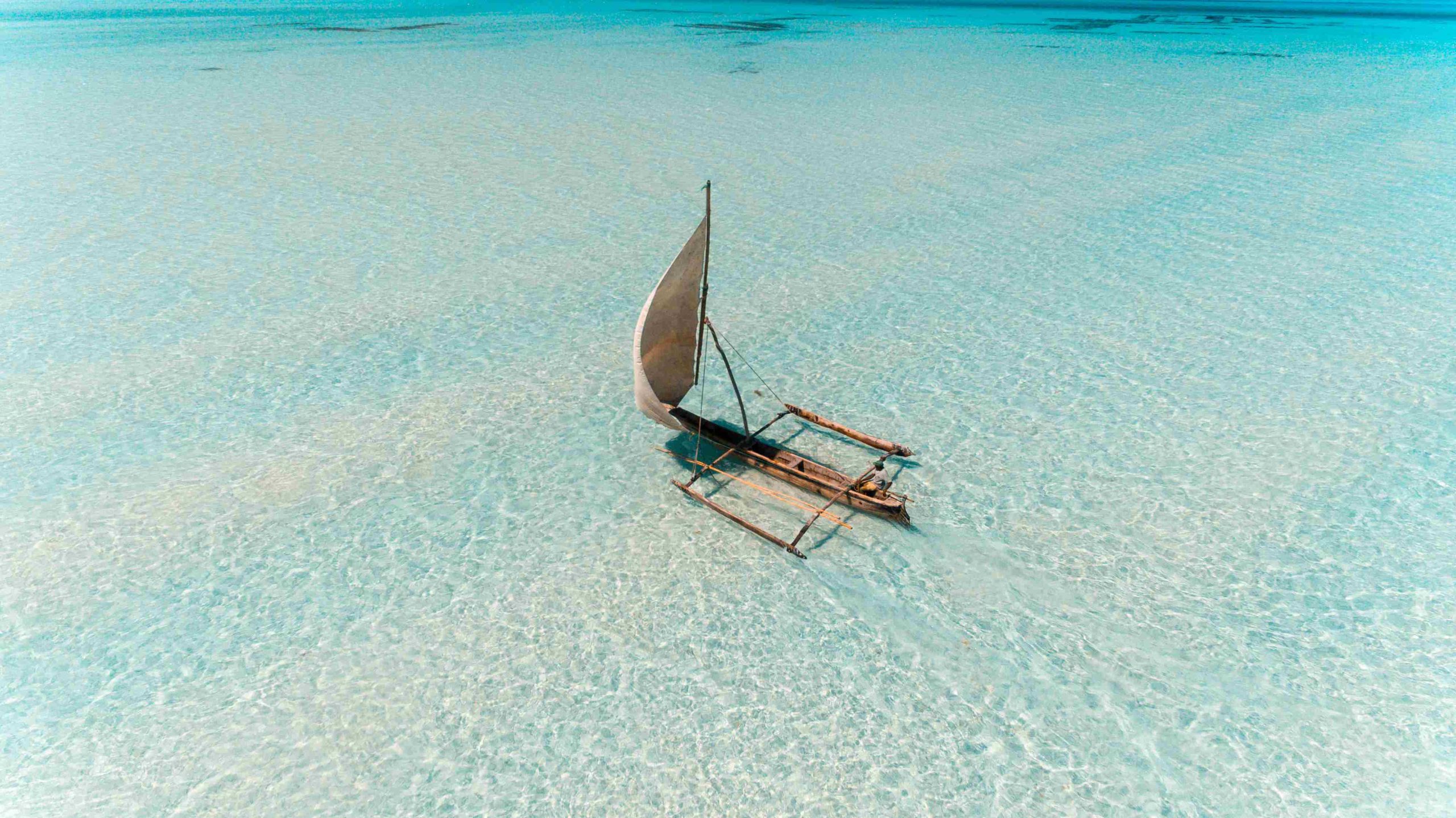 Zanzibar beach with a dhow at sunset