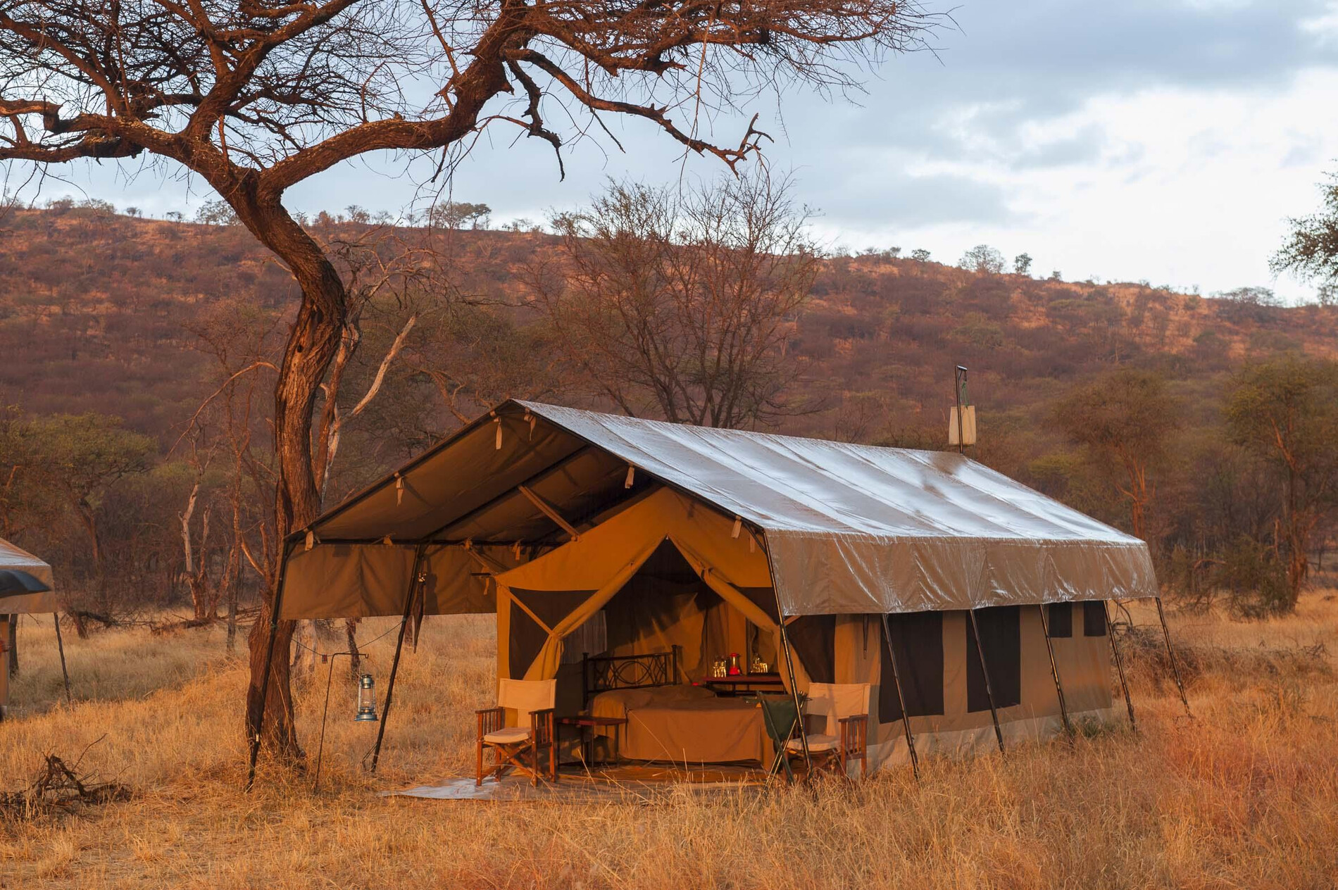Luxury tented camp overlooking the Serengeti plains at dusk