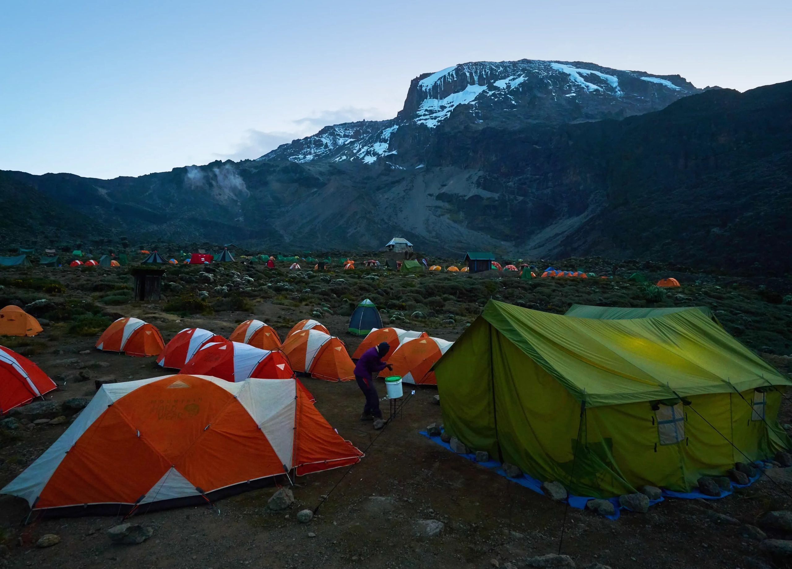 A guide checking a climber on the trail