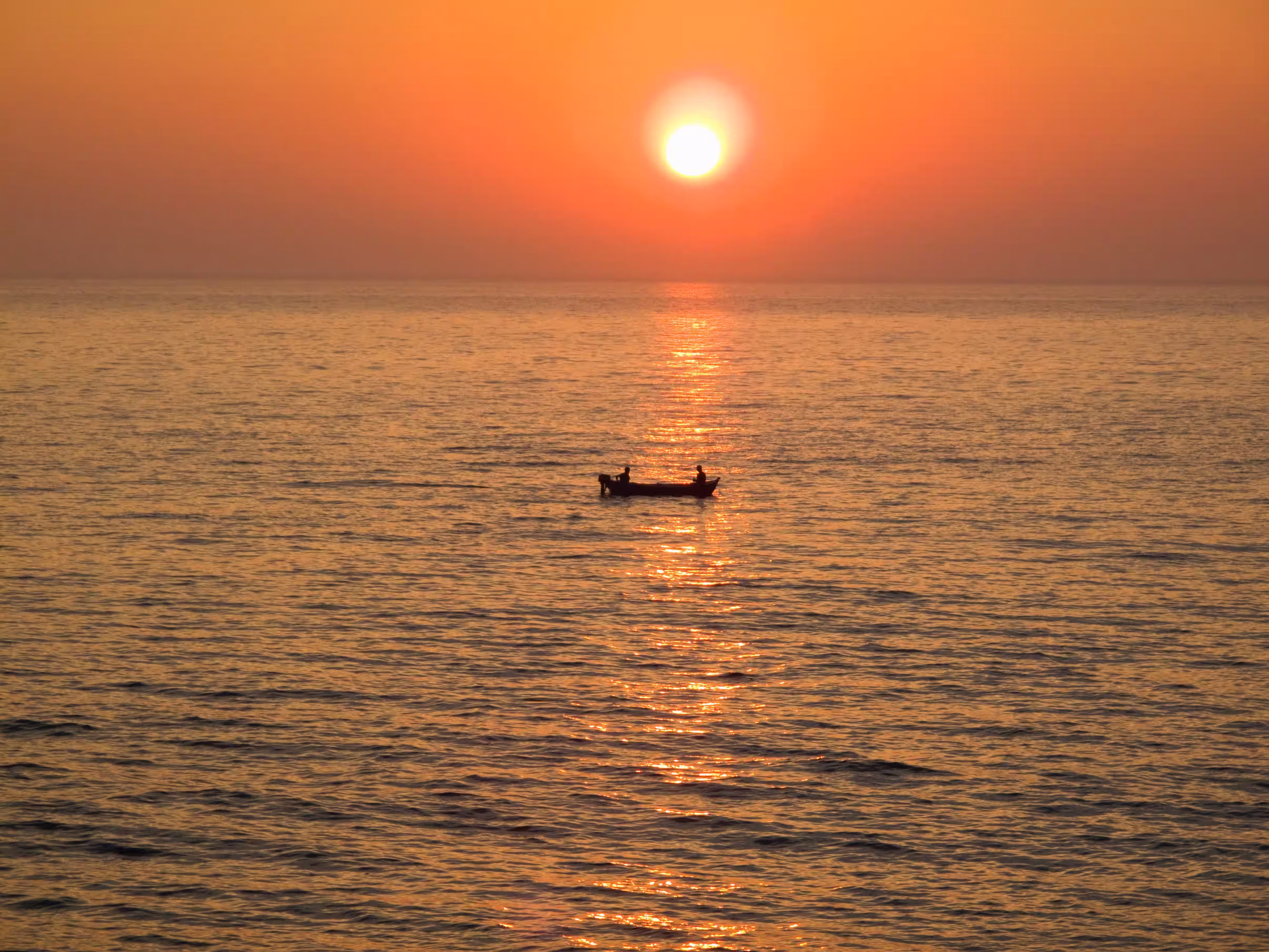 Sunset over Lake Tanganyika with the Mahale Mountains in silhouette