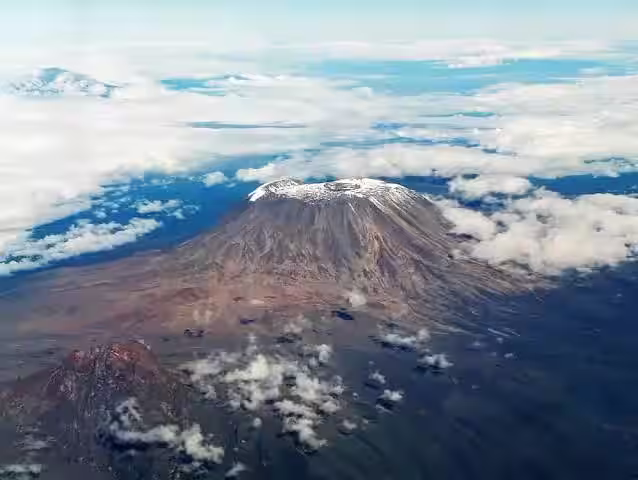 The snow-capped summit of Kilimanjaro above the clouds