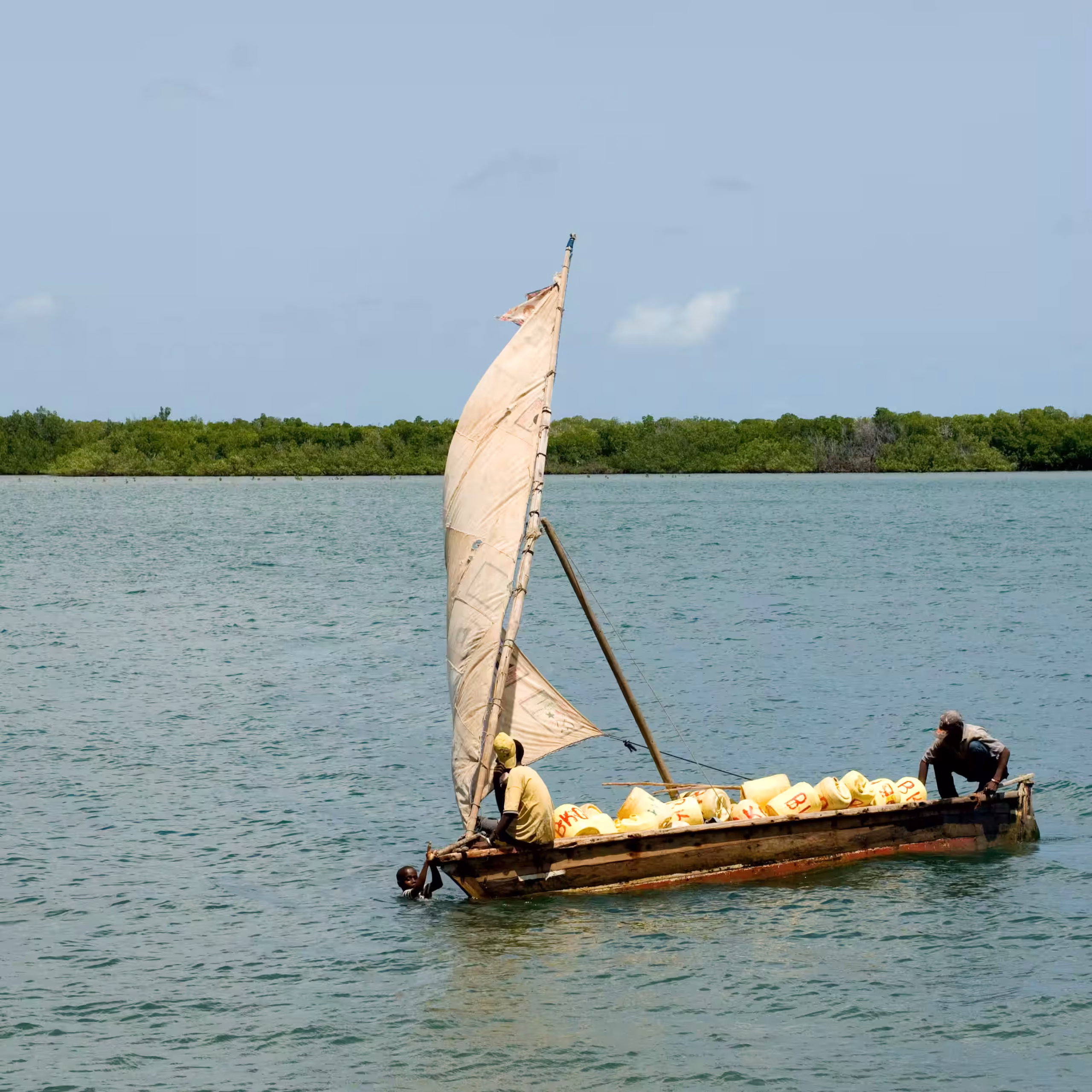 Dhow sailing on the lake at sunset